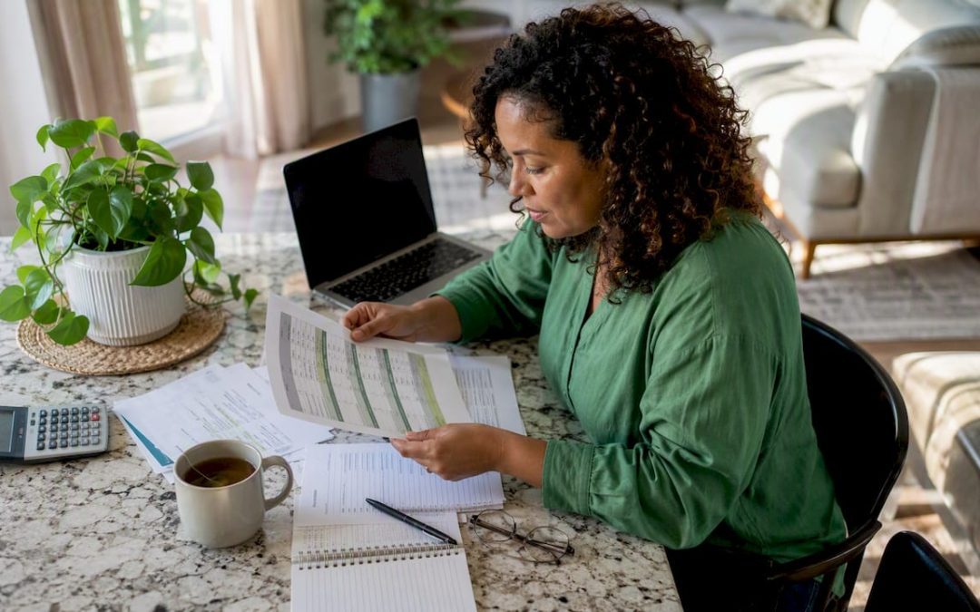 Woman reviewing home inspection provider comparison