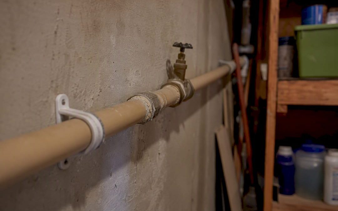 Close-up polybutylene plumbing pipe in home utility space