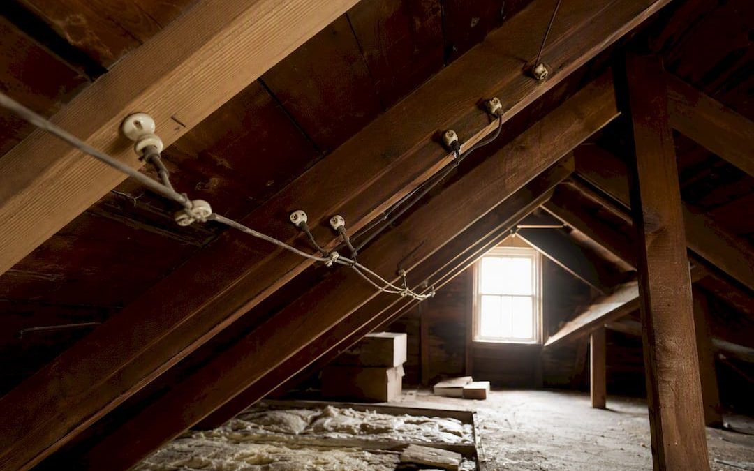 Close-up of knob-and-tube wiring in attic