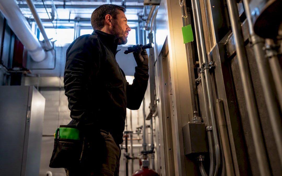 Inspector examining commercial building systems
