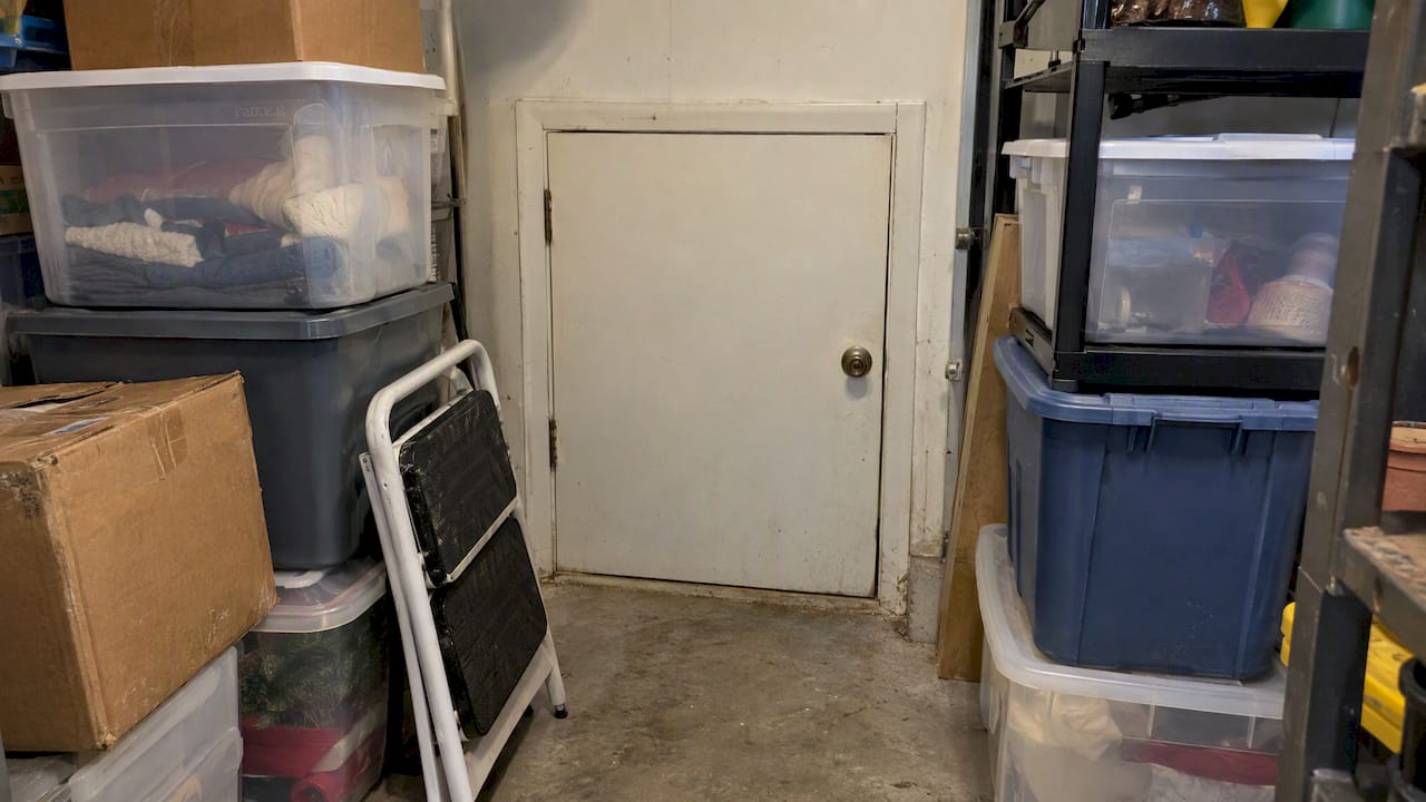 Stored belongings blocking a utility room access door